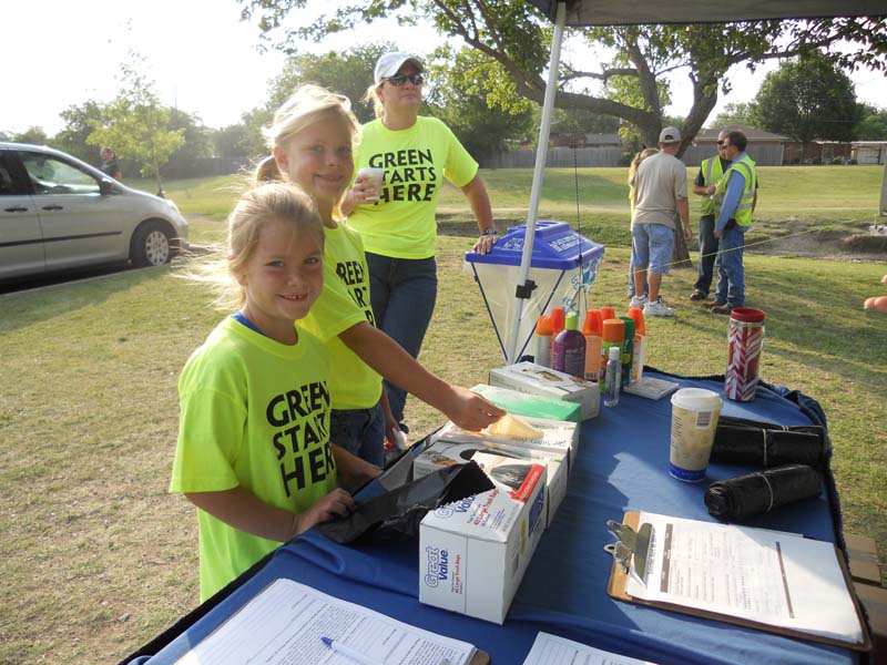 photo of kids and adults participating in clean up